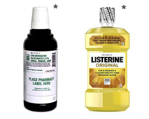Two bottles of Listerine mouthwash on a white background