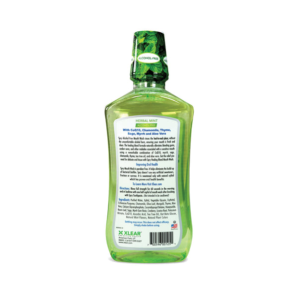 Green bottle of Xlear herbal mint product on a white background