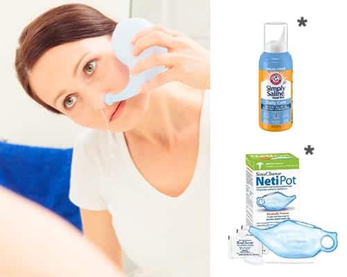 Woman using a neti pot with a bottle of saline solution and Neti Pot packaging on a white background.