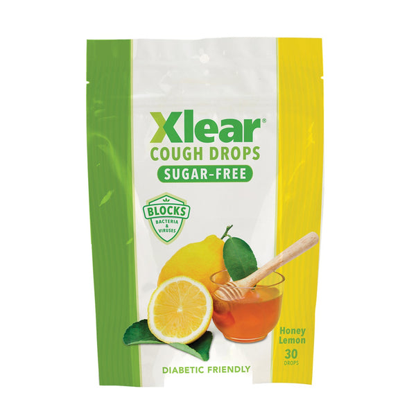 Xlear cough drops packaging with lemon and honey illustration on a white background