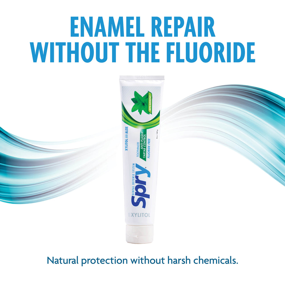 Spry enamel repair toothpaste tube with blue and green design on a white background