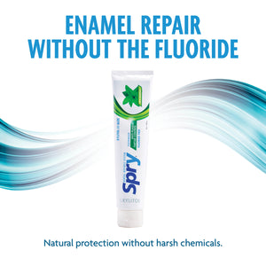 Spry enamel repair toothpaste tube with blue and green design on a white background