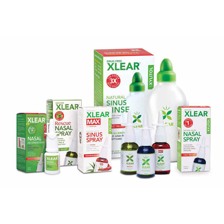 Collection of Xlear products including nasal sprays and boxes on a white background