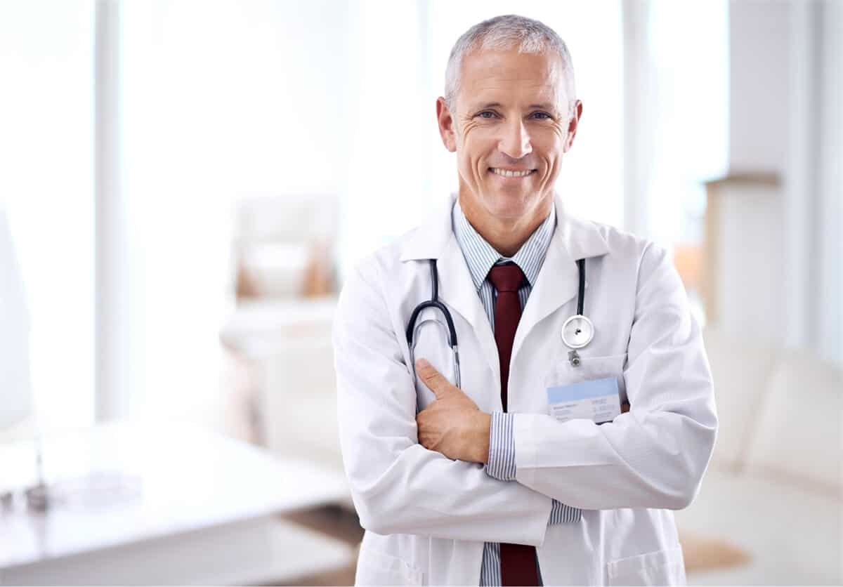 smiling male doctor in office